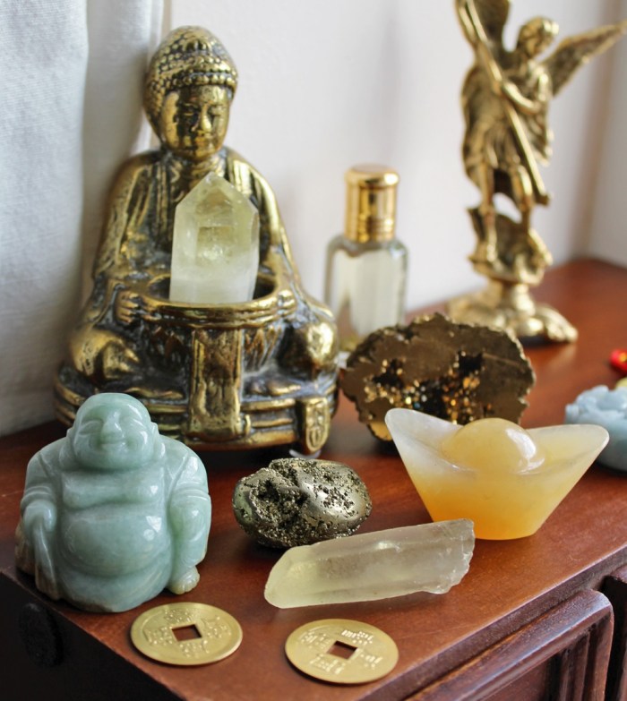Prosperity altar, coins, ingot, Buddha and crystals for money